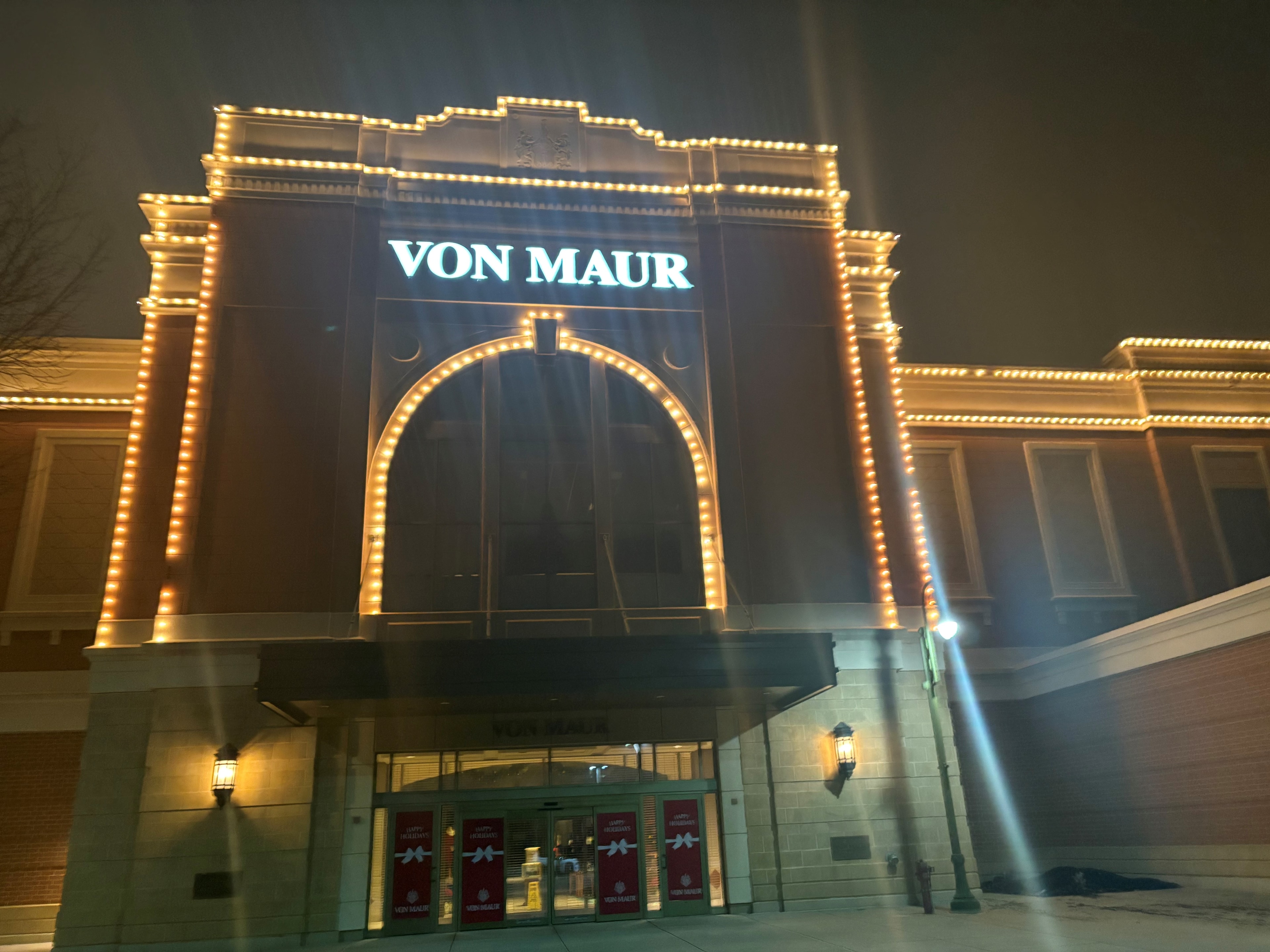 Warm-white lighting outlining the upper north entrance of Von Maur